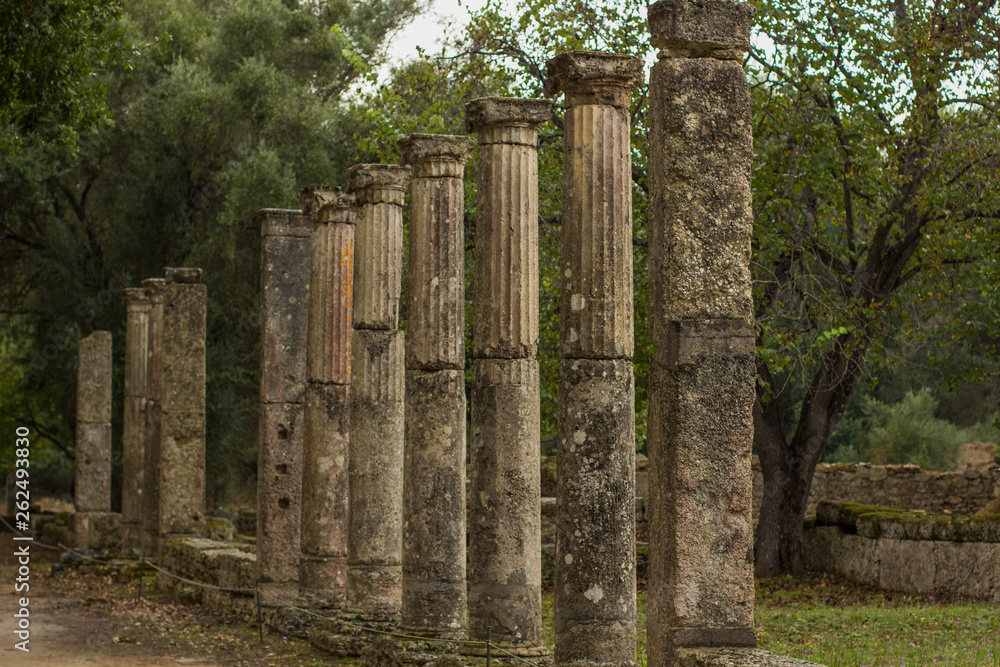 ancient Greece stone building from antique city in park outdoor space south European part of world in Peloponnese peninsula, soft focus pillars objects alley way