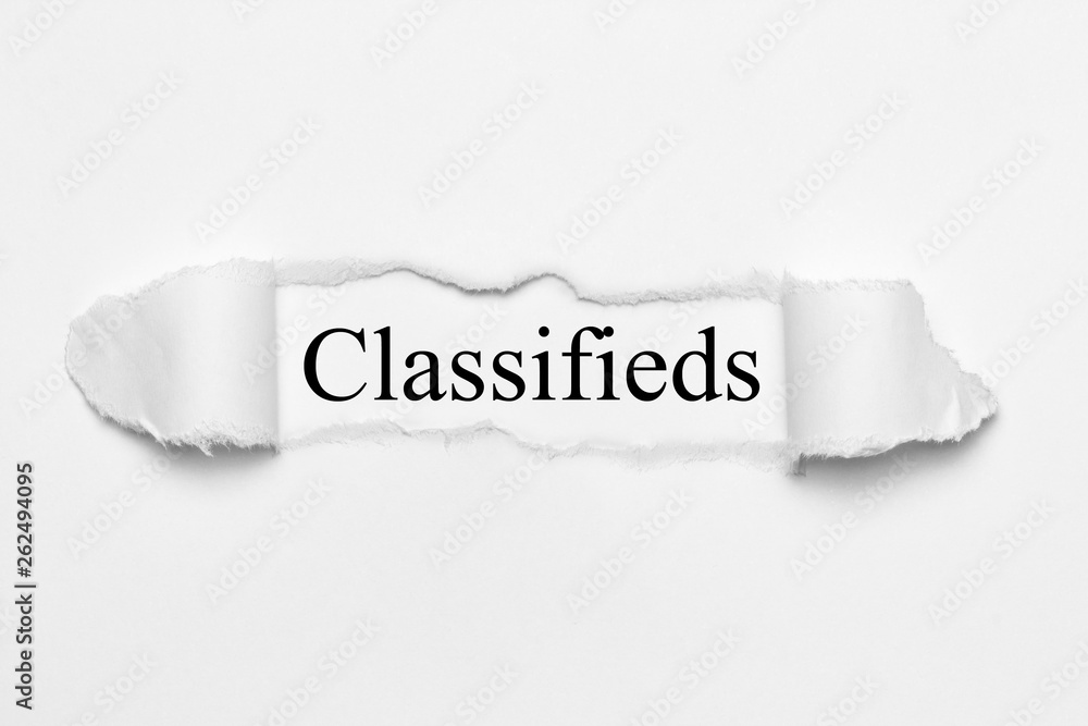 Classifieds on white torn paper Classifieds on white torn paper