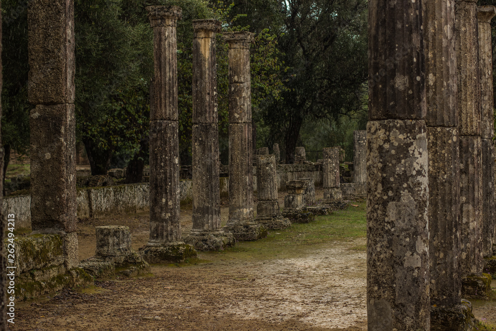 ancient Greece stone building from antique city in park outdoor space south European part of world in Peloponnese peninsula, soft focus pillars objects alley way ancient Greece stone building from antique city in park outdoor space south European part of world in Peloponnese peninsula, soft focus pillars objects alley way