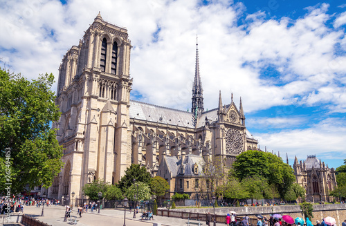 Summer view of famous Notre-Dame de Paris Cathedral under beautiful sky in Paris, France
