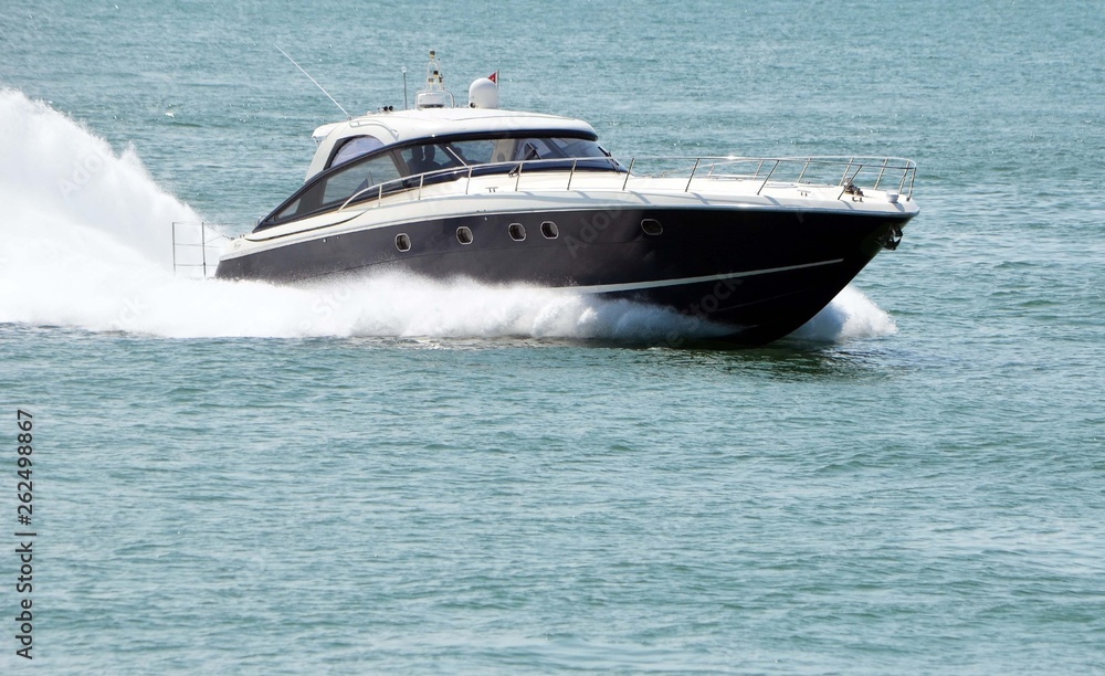 High-end cabin cruiser speeding of the coast of southeast Florida High-end cabin cruiser speeding of the coast of southeast Florida