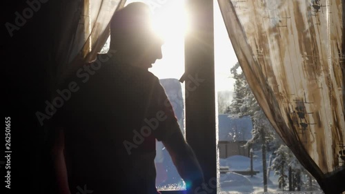 Young man enjoying view of mountain and forest in morning during sunrise. Rear back view. slow motion. 3840x2160