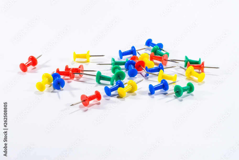 many peper pins put on the white background , they are stationary usefull for planing activity or seminar and other document work many peper pins put on the white background , they are stationary usefull for planing activity or seminar and other document work