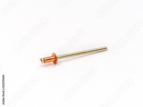 Copper flat pop rivet with zinc plated mandrel on white. © 2STOCKista