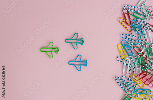 Business concept for group of stacked paperclip with group of plane paperclip is point to another direction as a team leadership and difference thinking
