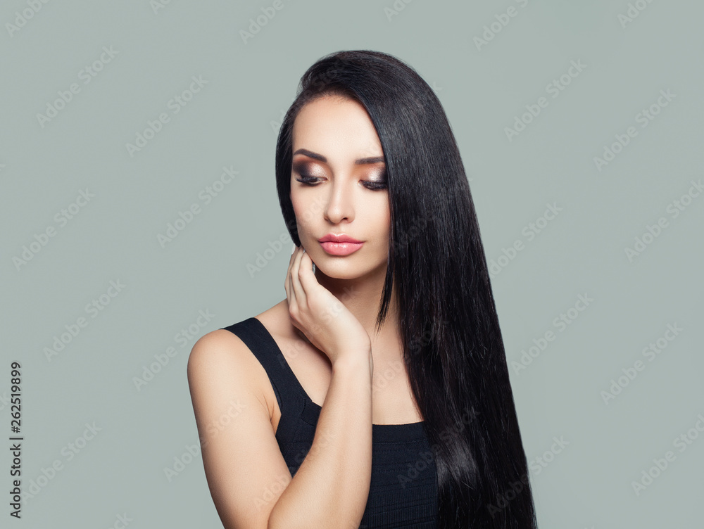 Young perfect woman with long dark straight hair and makeup portrait Young perfect woman with long dark straight hair and makeup portrait