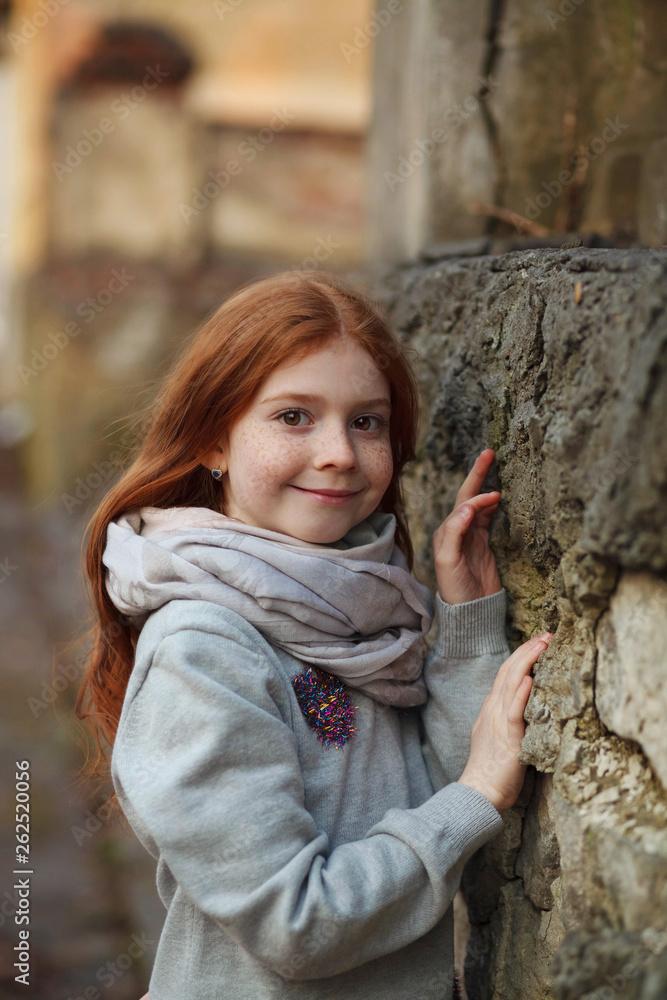 Portrait of a beautiful girl with red hair and freckles. Portrait of a beautiful girl with red hair and freckles.