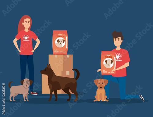 boy and girl volunteers with dog and food