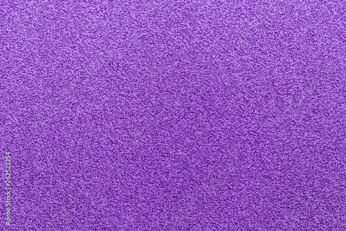 Purple carpet texture. Magenta color abstract wallpaper.