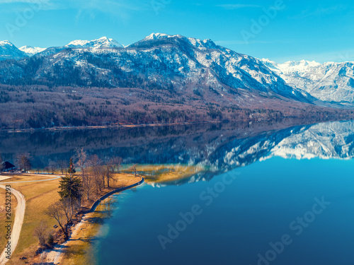 Fototapeta Naklejka Na Ścianę i Meble -  Mountain lake in early spring with snowy peaks. Beautiful nature. Reflection on the lake