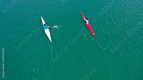 Aerial drone photo of women competing in sport canoe in calm water lake © aerial-drone