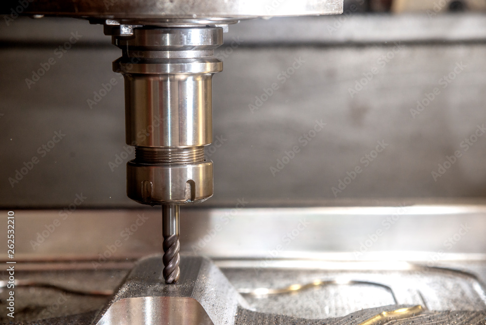 The CNC milling machine cutting the mould part with the solid ball end mill  tool.The hi-technology mould and die manufacturing process by CNC machining  center. foto de Stock | Adobe Stock