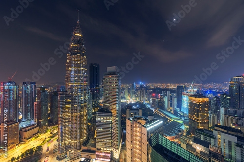 Beautiful night scene of iconic Kuala Lumpur landmark, aerial view illuminated by city light, cityscape landscape. photo