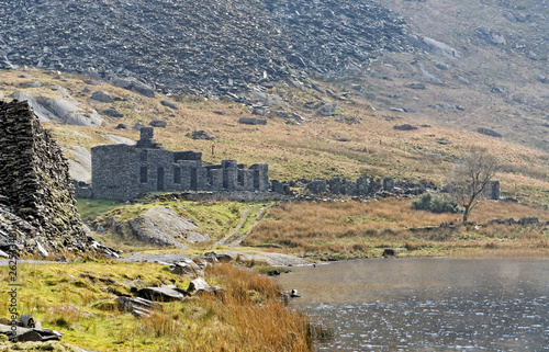 Ruins of a stone house on the Cwmorthin Waterfall trail in the mountains of Snowdonia National Park, Wales.