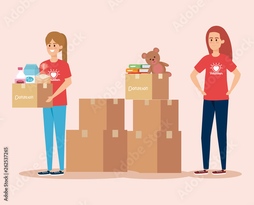 girls volunteers service with boxes donation