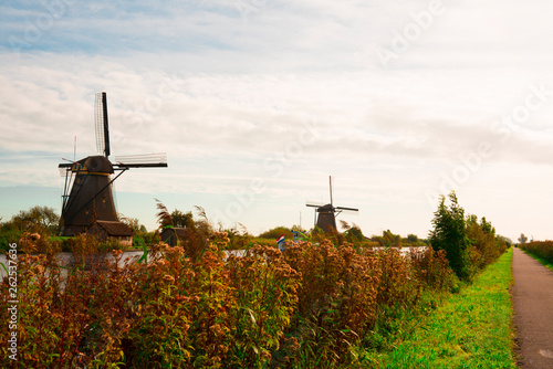 mill in Unesco place Kinderdijk, The Netherlands, along river Alblas photo