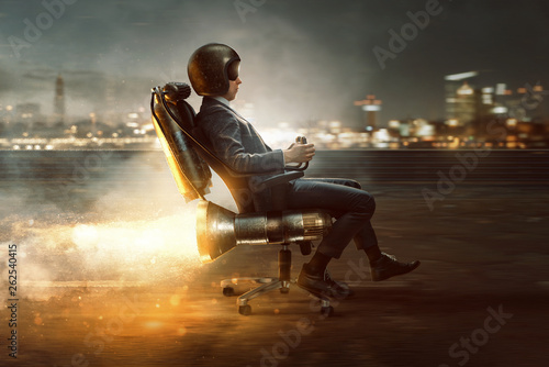 Geschäftsmann rollt auf Bürostuhl mit Raktenantrieb photo