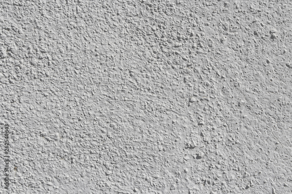 Beautiful horizontal texture of part of old concrete wall painted in gray and white color and with holes on the photo Beautiful horizontal texture of part of old concrete wall painted in gray and white color and with holes on the photo