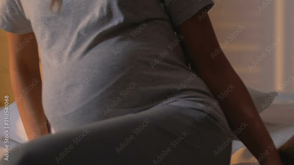 Pregnant lady lying bed to sleep on side position, health care during trimester Pregnant lady lying bed to sleep on side position, health care during trimester