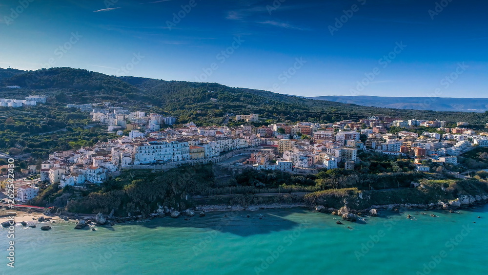 16261_Aerial_shot_of_the_white_apartment_buildings_in_the_coastal_town_in_Italy.jpg