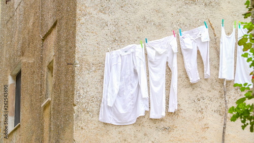 16469_White_clothes_hanging_on_the_white_house_in_Erice_Trapani_in_Italy.jpg © Nordicstocks