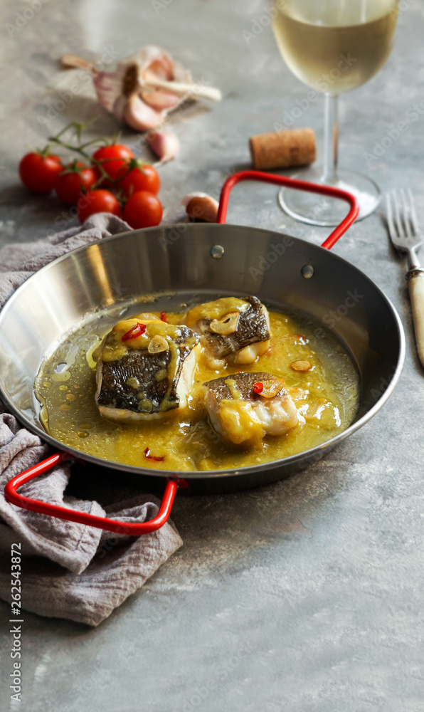 bacalao al pil pil, salted cod in emulsified olive oil sauce, spanish