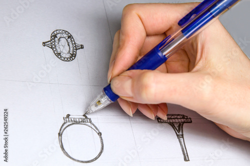 Drawing Jewelry Design. Artist designer drawing sketch jewelry on paper . Hand made.