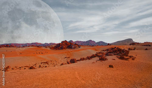 Fototapeta Naklejka Na Ścianę i Meble -  Red planet with arid landscape, rocky hills and mountains, and a giant Mars-like moon at the horizon, for space exploration and science fiction backgrounds. Elements of this image furnished by NASA.
