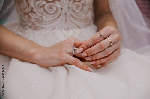 wedding rings on the bride's hand