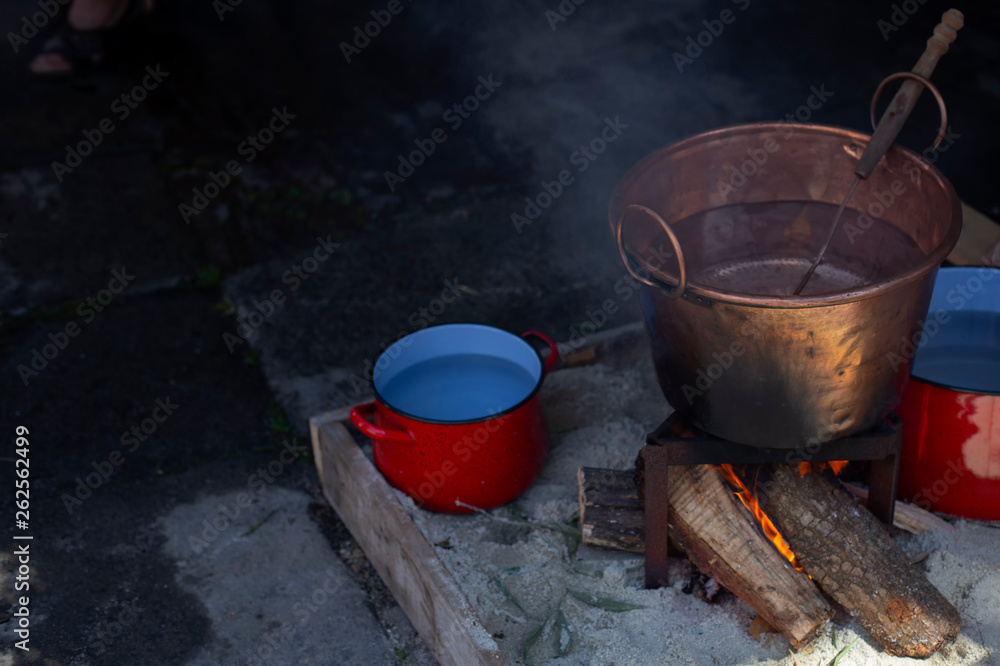 A pot of boiling water on fire A pot of boiling water on fire