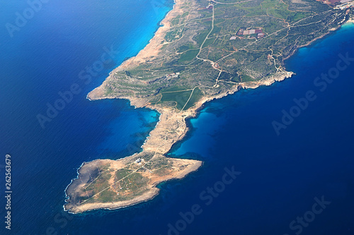 View from an airplane of island of Cyprus. Seacoast line with blue Mediterranean sea photo