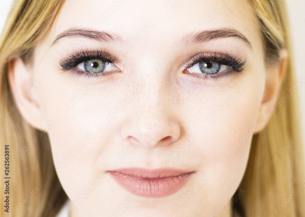 The girl's face is a blonde. Close-up. Facial care The girl's face is a blonde. Close-up. Facial care