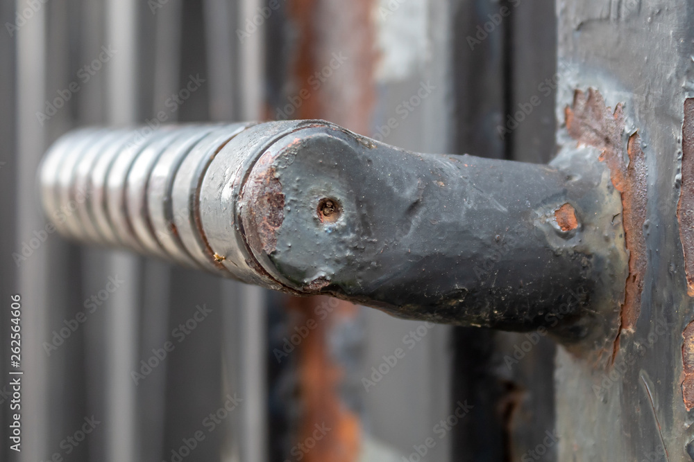 Metal Door Handle on Very Old Metal Fence