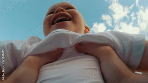 Father hands throw up little cute smiling son playing together POV shot photo