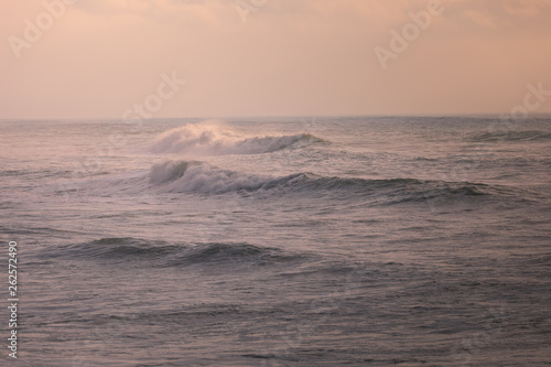 Waves at the sunsent in the basques' beach at Biarritz, Basque Country. photo