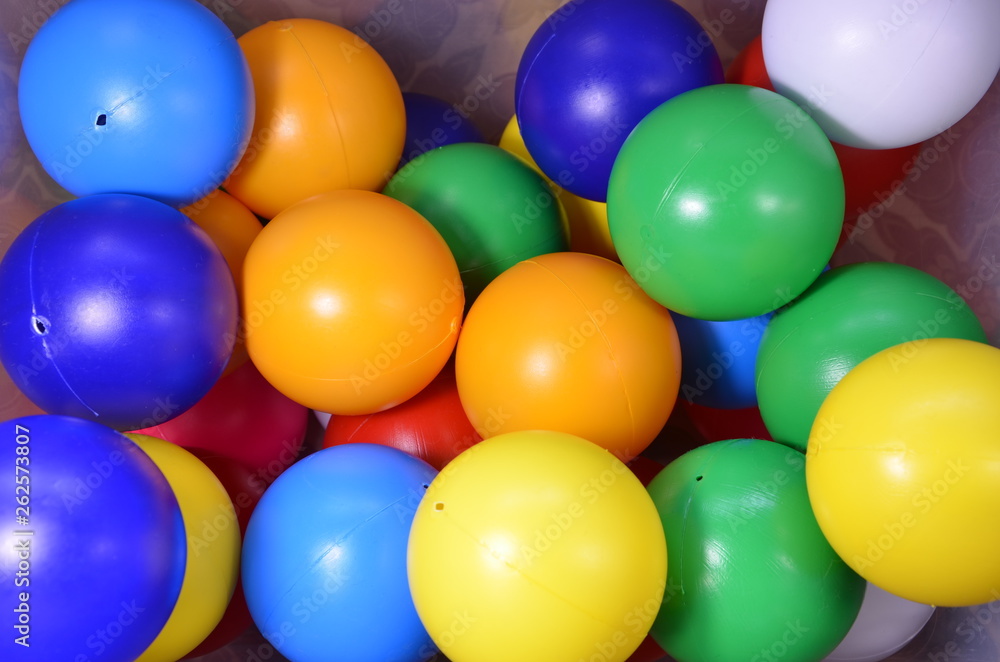 Plastic colored children's balls. Bright round balls for children's pools and games Plastic colored children's balls. Bright round balls for children's pools and games