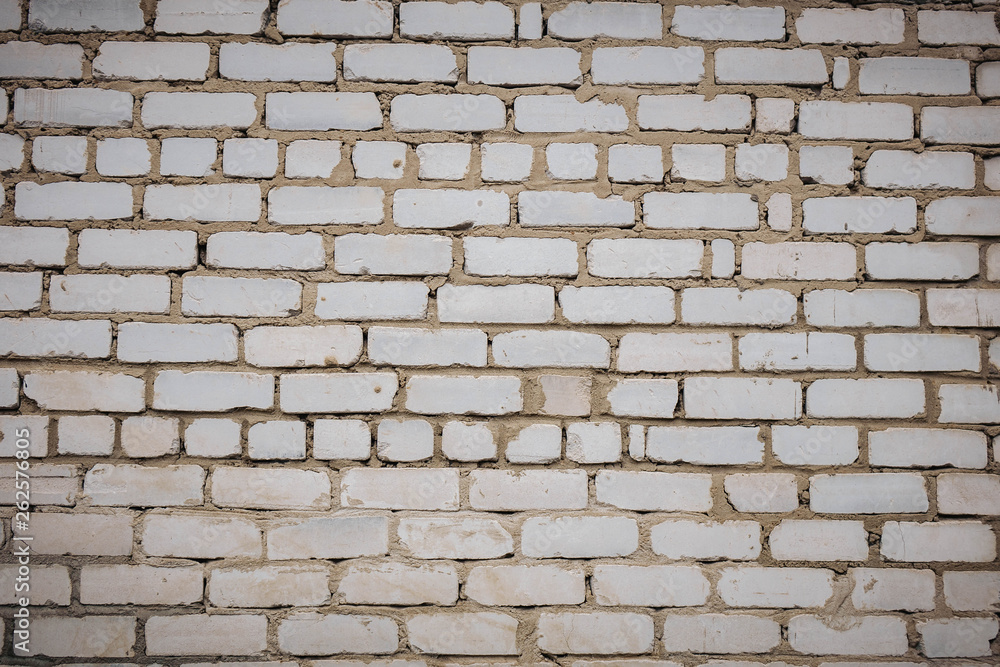 Wall is made from bricks and painted with white color. Wall is made from bricks and painted with white color.