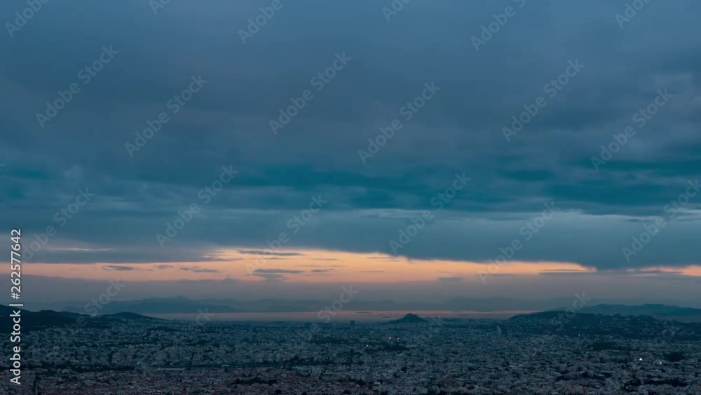 Dark clouds moving above the city of Athens in Greece. View form Pentelicus mount. Day to night timelapse sunset shot, Dark clouds moving above the city of Athens in Greece. View form Pentelicus mount. Day to night timelapse sunset shot,