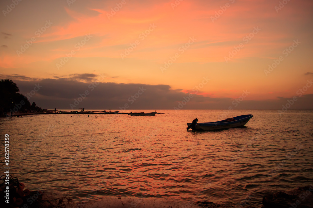 Beautiful colorful sunset of a mexican beach in the caribbean Beautiful colorful sunset of a mexican beach in the caribbean