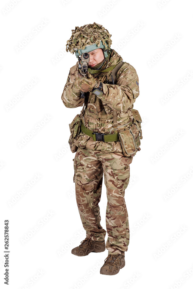 Modern british soldier with rifle isolated on a white background Modern british soldier with rifle isolated on a white background