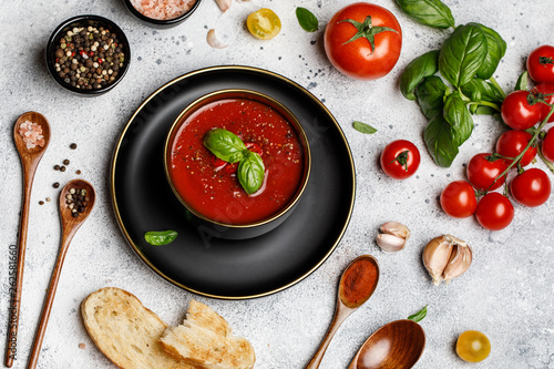 Obraz na plátně Traditional Spanish cold tomato soup gazpacho in a bowl on stone background
