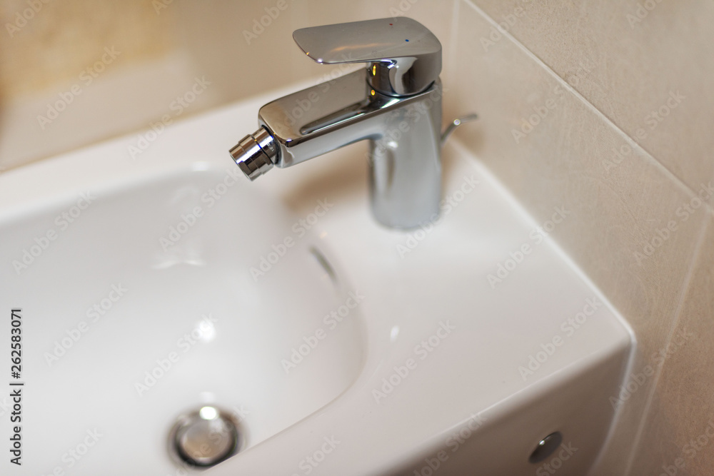 Sanitary fittings for bathrooms, faucets, shower cubicles, water taps, ceramic tiles and mosaics. Sanitary fittings for bathrooms, faucets, shower cubicles, water taps, ceramic tiles and mosaics.
