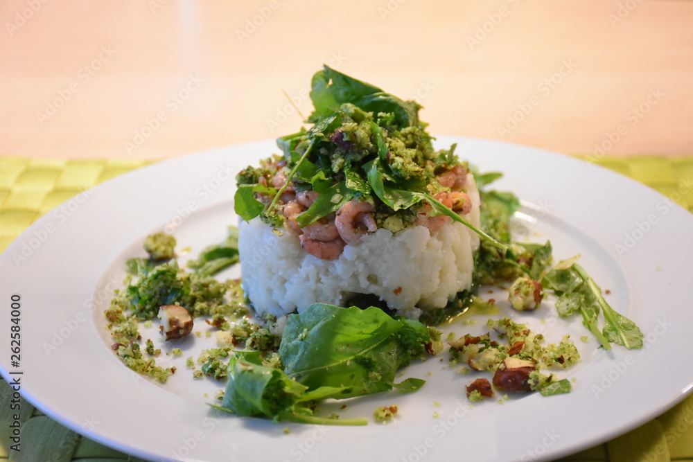 Nice looking meal with cauliflower, shrimps, spinach and nuts Nice looking meal with cauliflower, shrimps, spinach and nuts