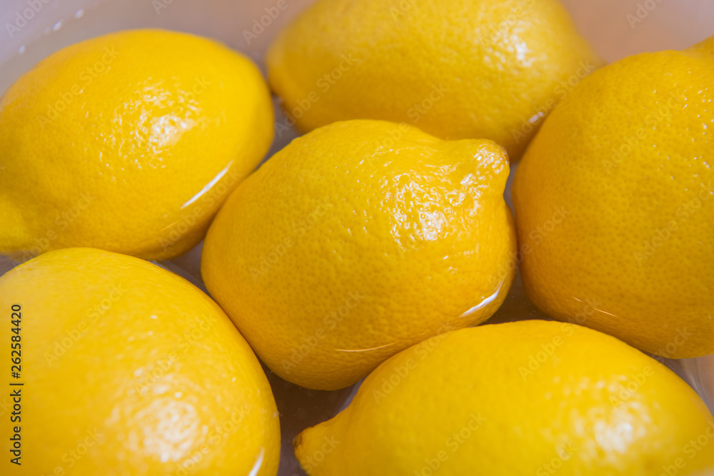 Fresh yellow lemons on a wooden background.. sweet lime, vitamin c. Fresh yellow lemons on a wooden background.. sweet lime, vitamin c.