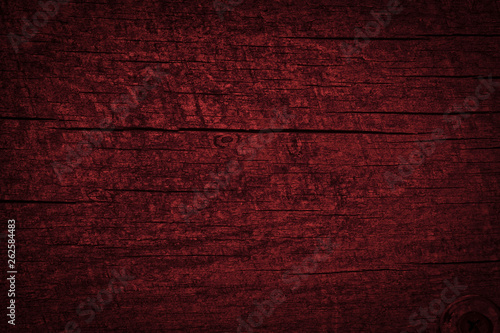 Texture of dark burgundy old rough wood. Mahogany abstract background for design. Vintage retro