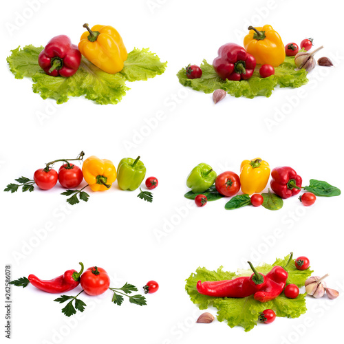 Yellow and red sweet pepper with tomatoes. Red sweet long pepper with yellow sweet pepper and tomatoes on a white background. Composition of yellow and red peppers with tomatoes on a white background.