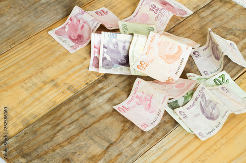 Turkish Liras paper on dirty wood background photo