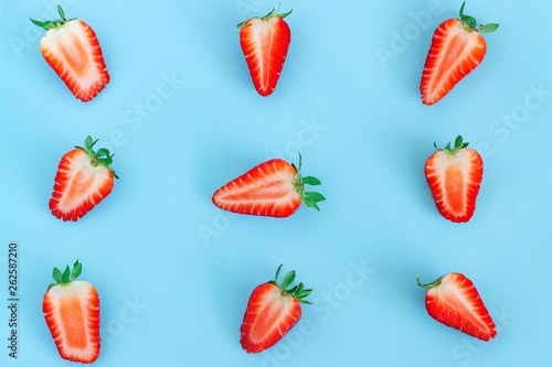 strawberry pattern on blue background, Summer concept. Flat lay, top view, square.