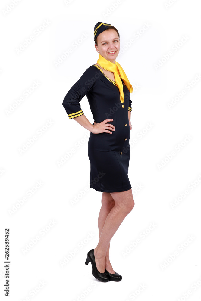 Stewardesse - Charming and smiling stewardess wearing in the blue uniform. Isolated on white background Stewardesse - Charming and smiling stewardess wearing in the blue uniform. Isolated on white background