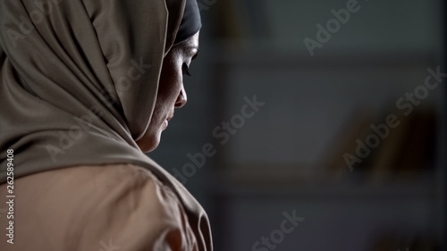 Unhappy arab woman in hijab close-up, pessimistic mood, sorrow, melancholy